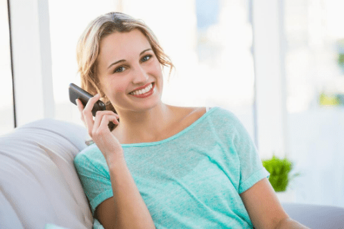 a lady happily taking phone call